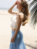 Diseño strapless con silueta ajustada al busto. Presenta capas de volantes superpuestos que aportan volumen y movimiento, creando un estilo femenino y llamativo. Ideal para looks frescos y veraniegos

Detalles:

Color: Blanco

Material: 90% Rayon 10% Poliester